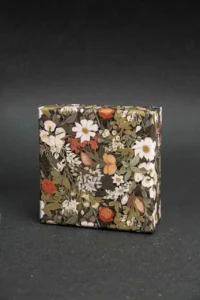 Close-up view of detailed printing on a gift box with a focus on color and texture.