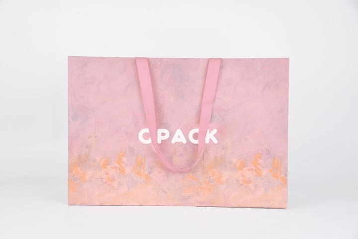 Pink luxury paper shopping bag for apparel boutiques
